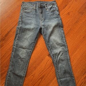Blue/grey articles of society skinny denim jeans with distressed bottoms